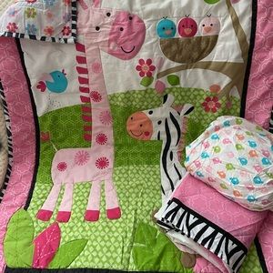 3 piece baby crib set. Pink w/ zoo animal design.